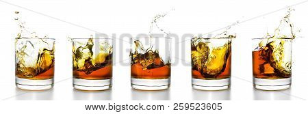 Set Of Scotch Whiskey Glasses With Splash Isolated On White