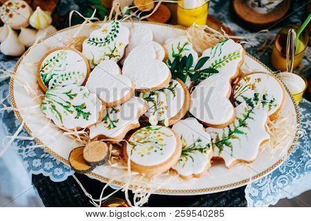 Tasty Gingerbread Cookies Covered With White Icing Decorated With Paintings. Spring Holiday Candybar