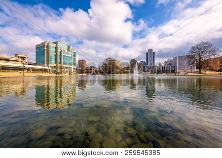 Huntsville, Alabama, USA park and downtown cityscape.