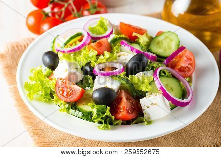 Fresh Greek Salad Made Of Cherry Tomato, Ruccola, Arugula, Feta, Olives, Cucumbers, Onion And Spices