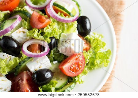 Fresh Greek Salad Made Of Cherry Tomato, Ruccola, Arugula, Feta, Olives, Cucumbers, Onion And Spices