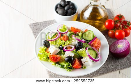 Fresh Greek Salad Made Of Cherry Tomato, Ruccola, Arugula, Feta, Olives, Cucumbers, Onion And Spices