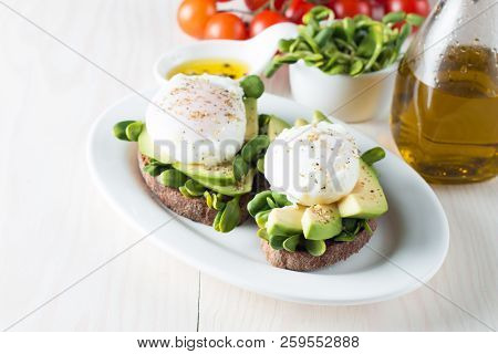 Avocado Toast, Cherry Tomato On Wooden Background. Breakfast With Toast Avocado, Vegetarian Food, He