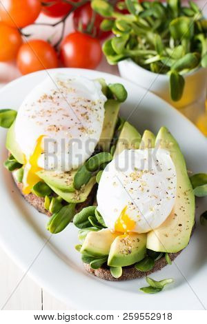Avocado Toast, Cherry Tomato On Wooden Background. Breakfast With Toast Avocado, Vegetarian Food, He