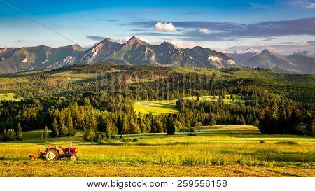 Breathtaking Sunset At Belianske Tatra Mountains With Tractor In Poland