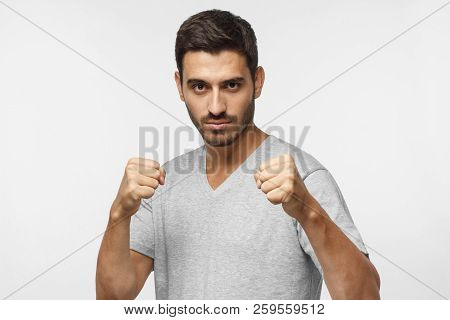 Confident Sporty Boxing Man Holding Fists In Front Of Him, Going To Fight And Defend Himself, Ready 