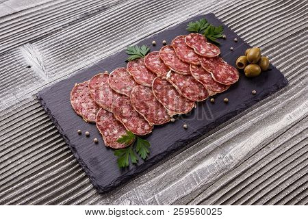 Saucisson Sec Delicious French Salami On A Wooden Background