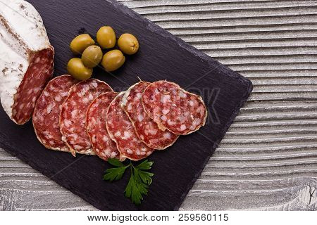 Saucisson Sec Delicious French Salami On A Wooden Background