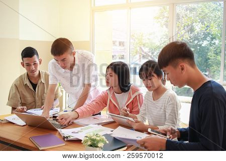 Co Working Team Meeting Concept: New Asian Genaration Business People Working And Studying Together 