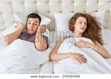 Stressful Man Suffers From Insomnia, Keeps Pillow On Head While Hears Wifes Snoring During Night, Sl