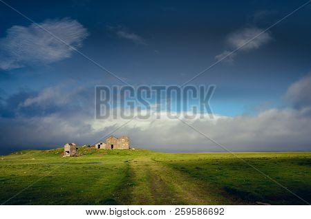 Landscape View Of Countryside With Ruins Of Abandoned Building, Iceland