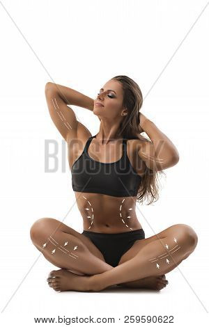 Muscular Female Bodybuilder Sitting In Yoga Pose