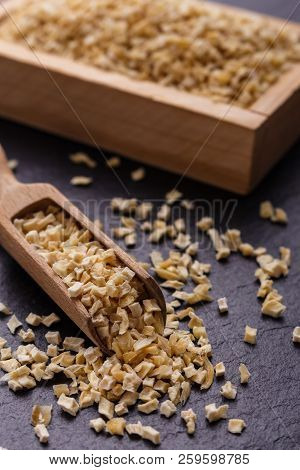 Fragrant Dried Parsnip On A Dark Stone Background
