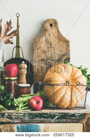 Autumn Food Ingredients And Utensils Over Cupboard Chest, Vertical Composition