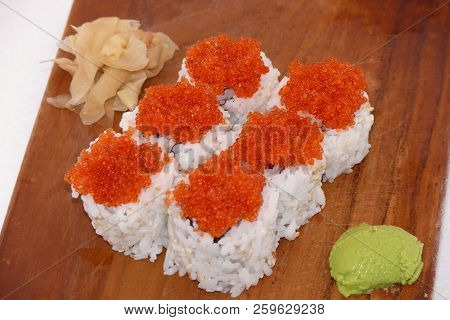Sushi California Philly Rolls Appetizer With Rice Avocado And Salmon On Square Blue Plate W/ Chopsti