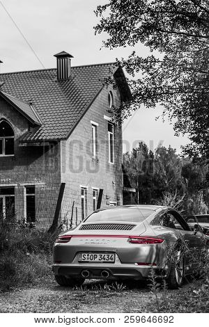 Minsk, Belarus - September 2, 2018: Logo Of Porsche 911 Gts On Back Of Silver Sportcar Rear Red Stop
