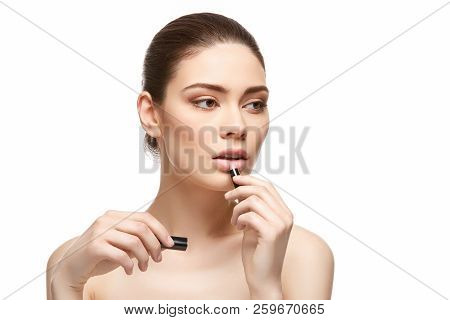 Girl Applying Pink Lipstick Isolated On White