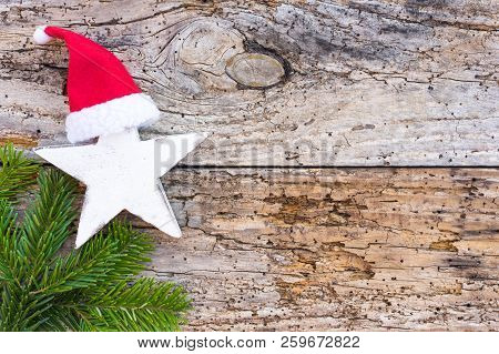 Christmas Star Ornaments On Rustic Old Wooden Background With Copy Space