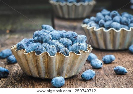 Summer Honeysuckle Berries In Metal Forms For Baking