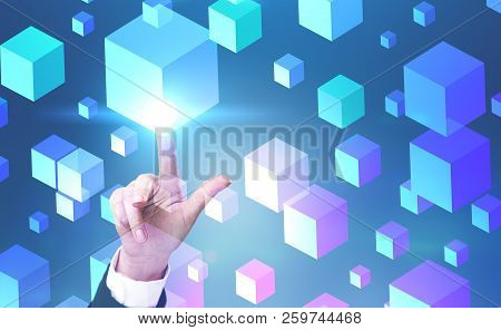 Hand Of Businesswoman Touching White Cubes Interface Over Blue Background. Concept Of Hi Tech. Copy 