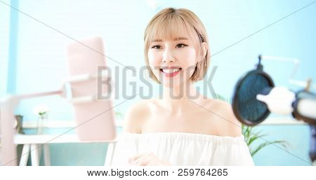 Woman Having Live Stream On Cellp Hone At Home