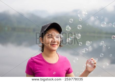 Thai Girl Enjoy  Her Lifestlye And Happy In The Morning With Air Bubbles