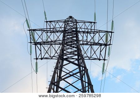 Electric Tower On Cloudy Sky Background. Industry, Electrification Theme.