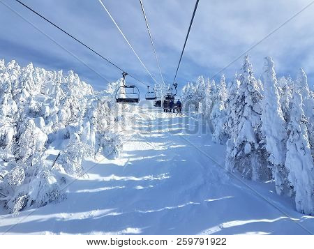 Chairlifts And Trails At Ski Resort On A Sunny, Beautiful Day.