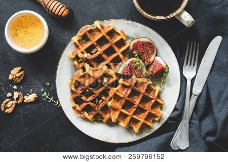 Whole Wheat Waffles, Honey And Coffee On Black Concrete Background. Table Top View Of Tasty Breakfas