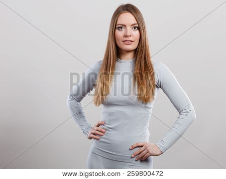 Clothing Fashion Sport Concept. Fit Female Wearing Thermoactive Underwear Top. Slim Woman In Sporty 