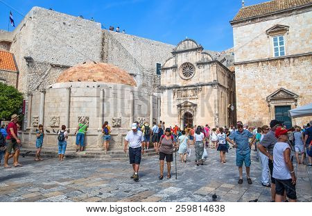 Dubrovnik, Croatia, September 17, 2016 - Tourists Standing On The Old Walls Of The City Of Durovnik,