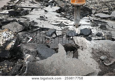 Excavator Breaking Concrete Road Surface With Hydrohammer Drill At Repairing Roadwork. Overhaul Of T