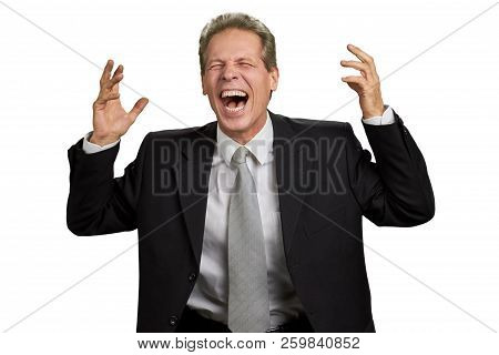 Hysterical Laughter Of Businessman. Man In Business Suit Laughing With Raised Hands Over White Backg