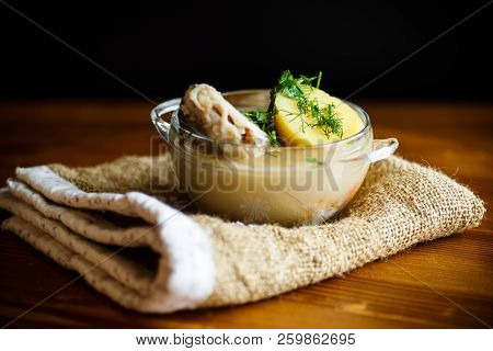 Vegetable Soup With Fish In A Glass Bowl