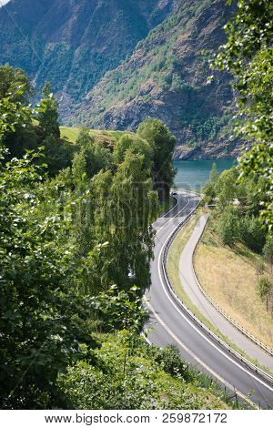 Aerial View Of Winding Road, Green Trees And Beautiful Mountains, Aurlandsfjord, Flam Aurlandsfjorde