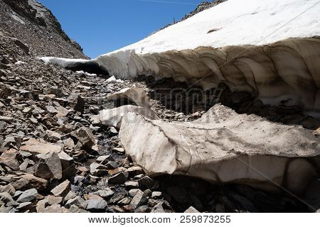Snow Cave During A Summer Hike In The High Elevation Area Of Eastern Sierra Nevada Along 20 Lakes Ba