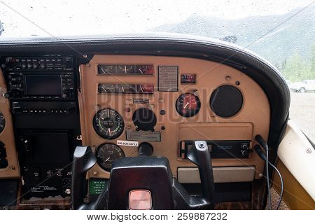 August 4 2018 - Chitina, Ak: Cockpit Copilot View Of The Instrument Panel Of A Cessna Airplane. Rain