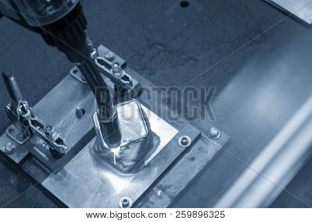 The Welding Robot Machine For Welding Automotive Part In The Light Blue Scene.industrial 4.0 Concept