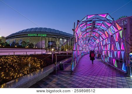 Tokyo, Japan - 13 Feb 2018: Tokyo Dome Arena And Neon Light Tunnel At Blue Hour