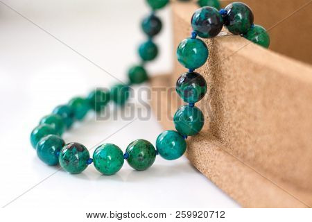 Beads From Turquoise Lie On A Box Of Cork Tree. Close-up, Macro