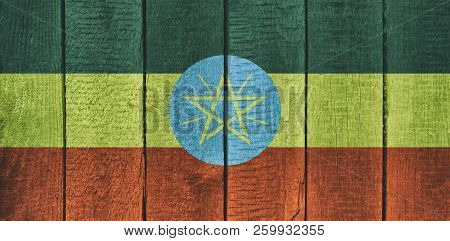 Old  Wooden Table Texture Background Top View  With A National Flag Of Ethiopia. Ethiopian Flags Ima