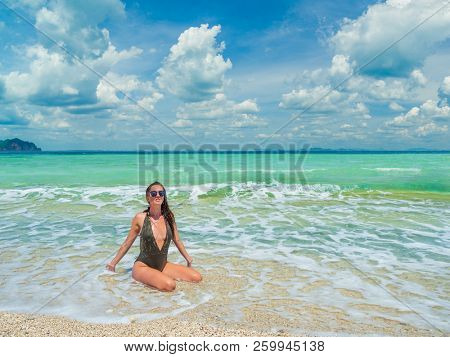 woman sunbathing on the beach summer travel holidays