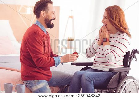 Cheerful Mid Aged Man Making A Proposal