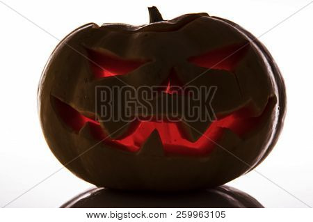 Scary Halloween Pumpkin On A White Background