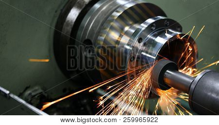 Sparks Flying While Machine Griding And Finishing Metal