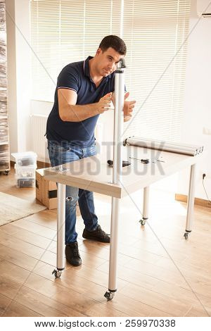 Man Assembly Furniture For New House They Purchased