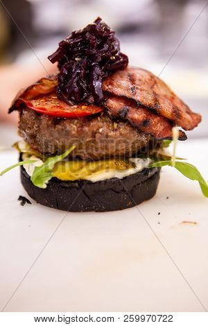 Chef Performs How To Make Proper Buger