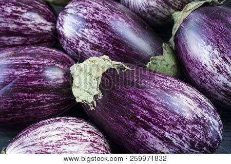 Background Of Fresh Eggplant. Aubergine Vegetable. Purple Eggplant (aubergine). Top View. Purple Foo