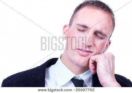 Close up Young business man with a teethache against a white background
