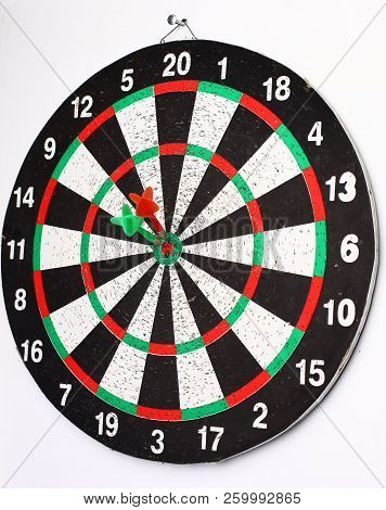 Closeup. Several Arrows Dart Hitting The Center Of The Target D